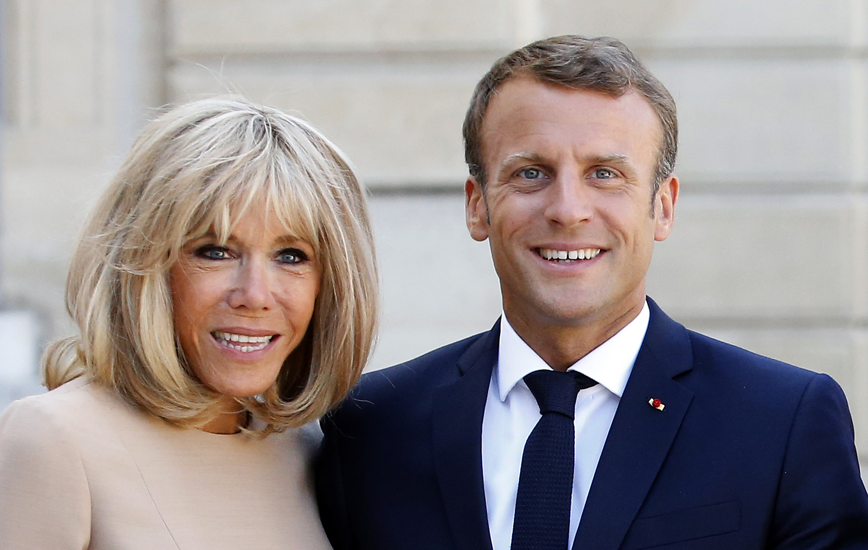 PARIS, FRANCE - AUGUST 22: French President Emmanuel Macron and his wife Brigitte Macron wait for Greek Prime Minister Kyriakos Mitsotakis and his wife Mareva Grabowski prior to their meeting at the Elysee Presidential Palace on August 22, 2019 in Paris, France. Kyriakos Mitsotakis is on an official visit to Paris. (Photo by Chesnot/Getty Images)
